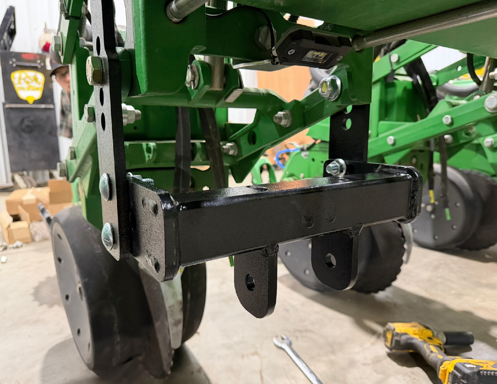Close-up of green agricultural machinery components.