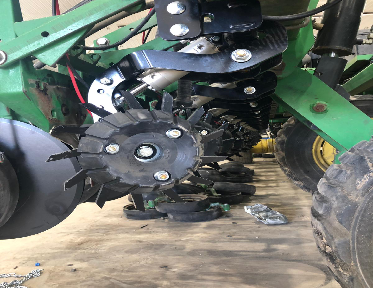Agricultural machinery with metal gears and wheels.