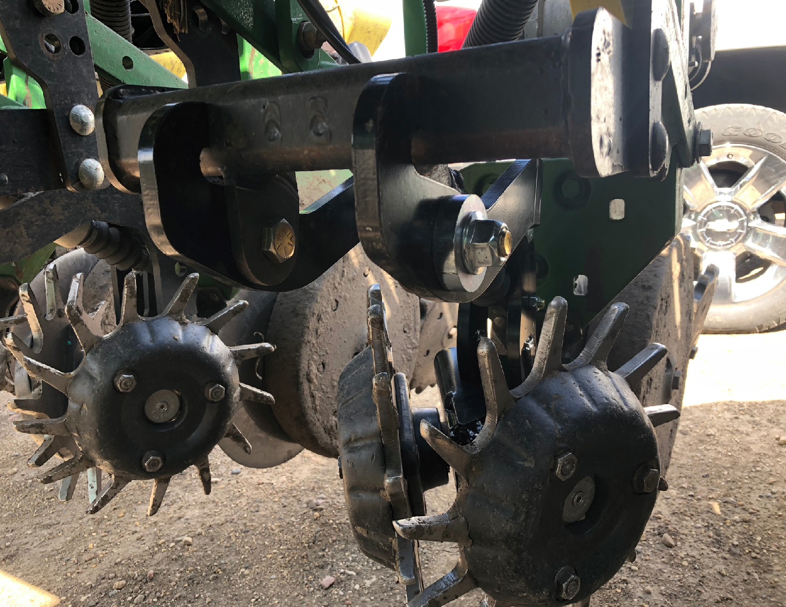 Agricultural machinery with spiked metal wheels.