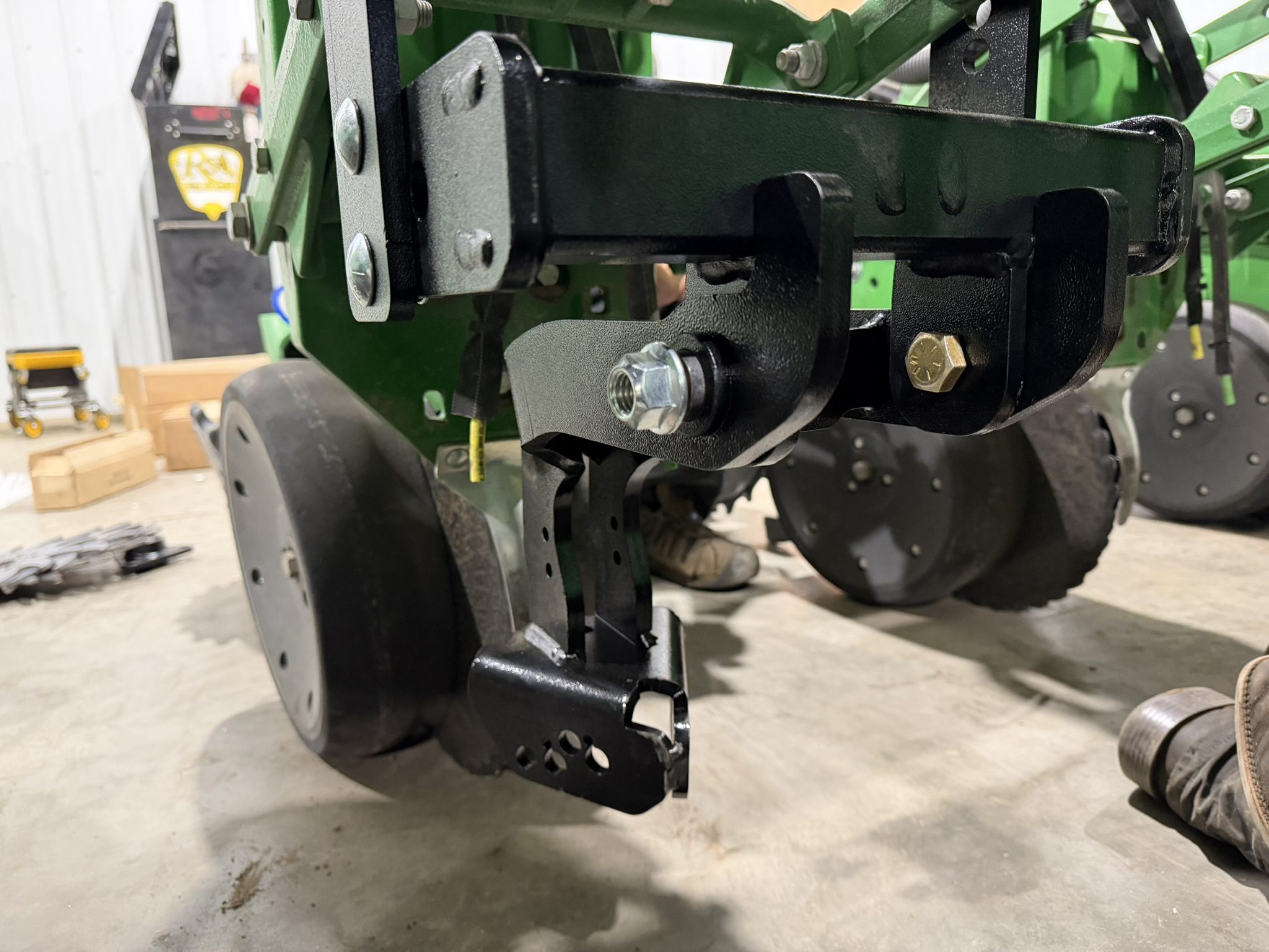 Close-up of agricultural machinery part in workshop.