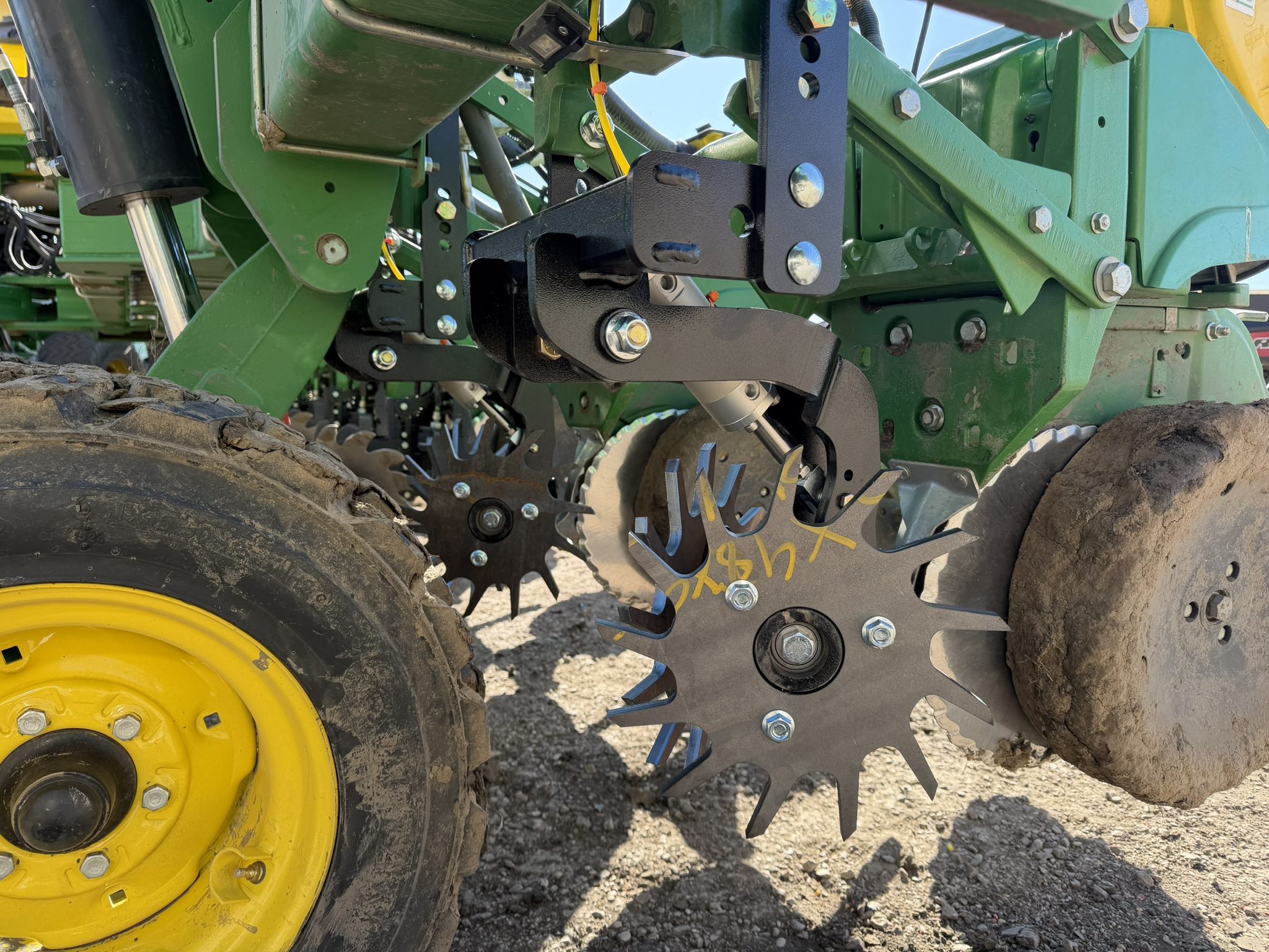 Agricultural machinery with spiked wheels close-up.