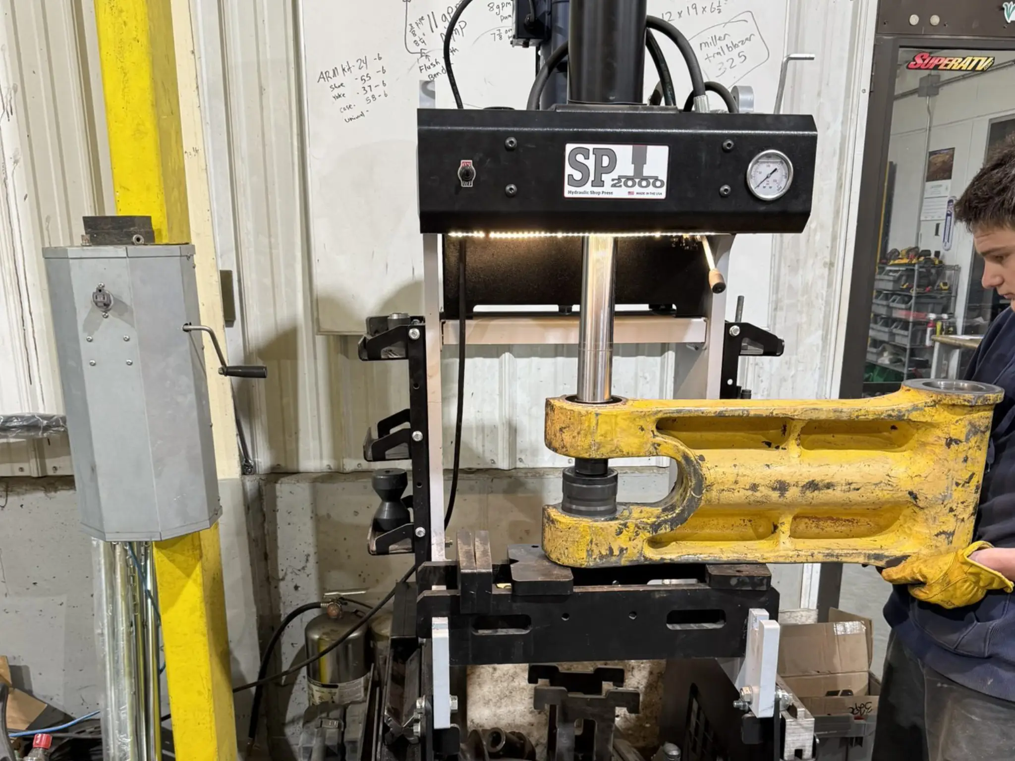 Hydraulic press machine in a workshop.
