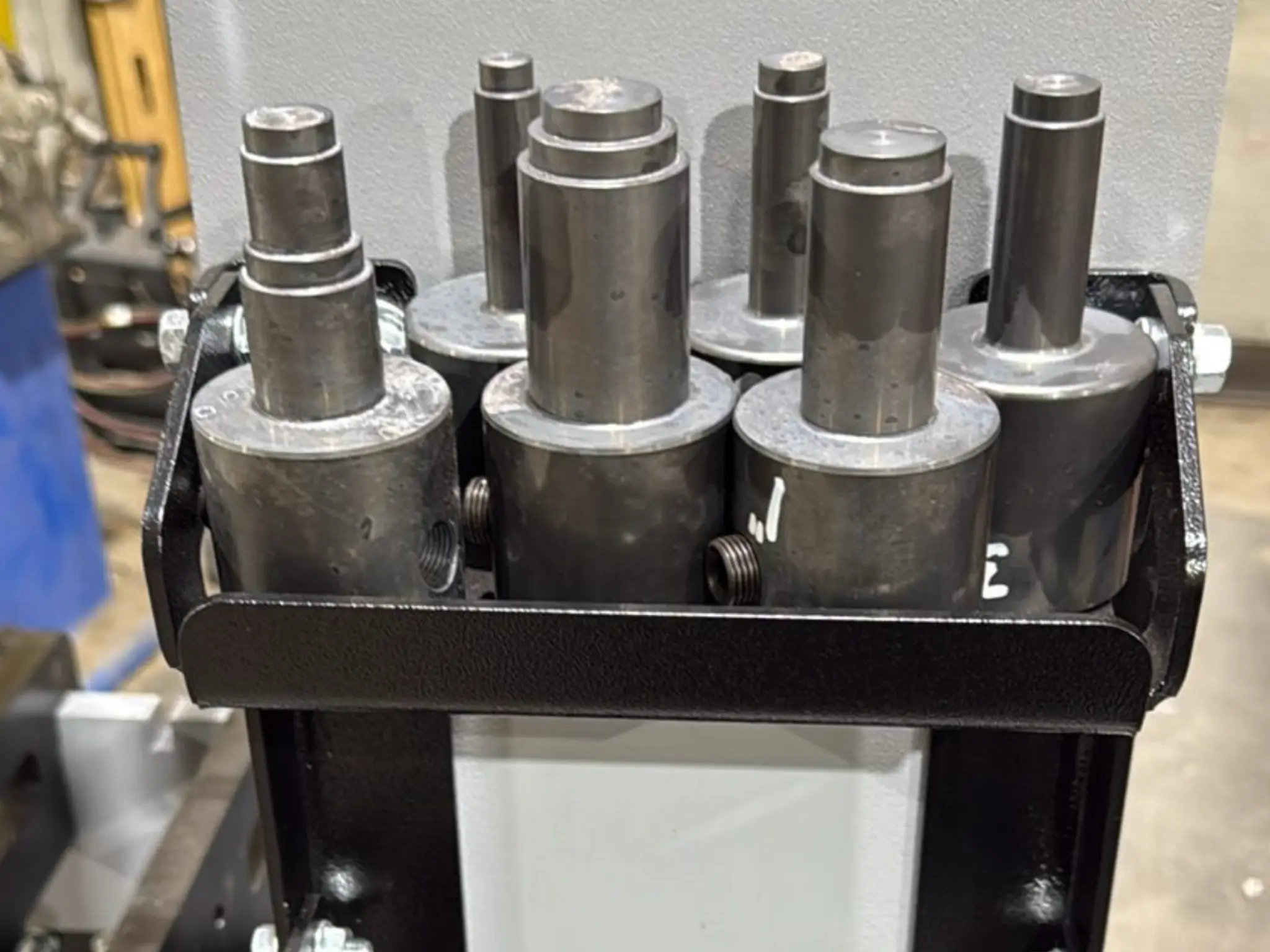 Metal cylinders in a black holder.