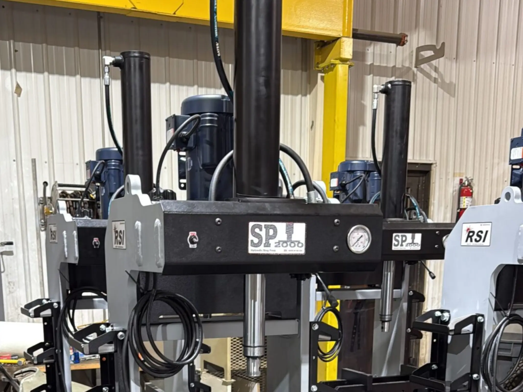 Hydraulic press machine in industrial setting.