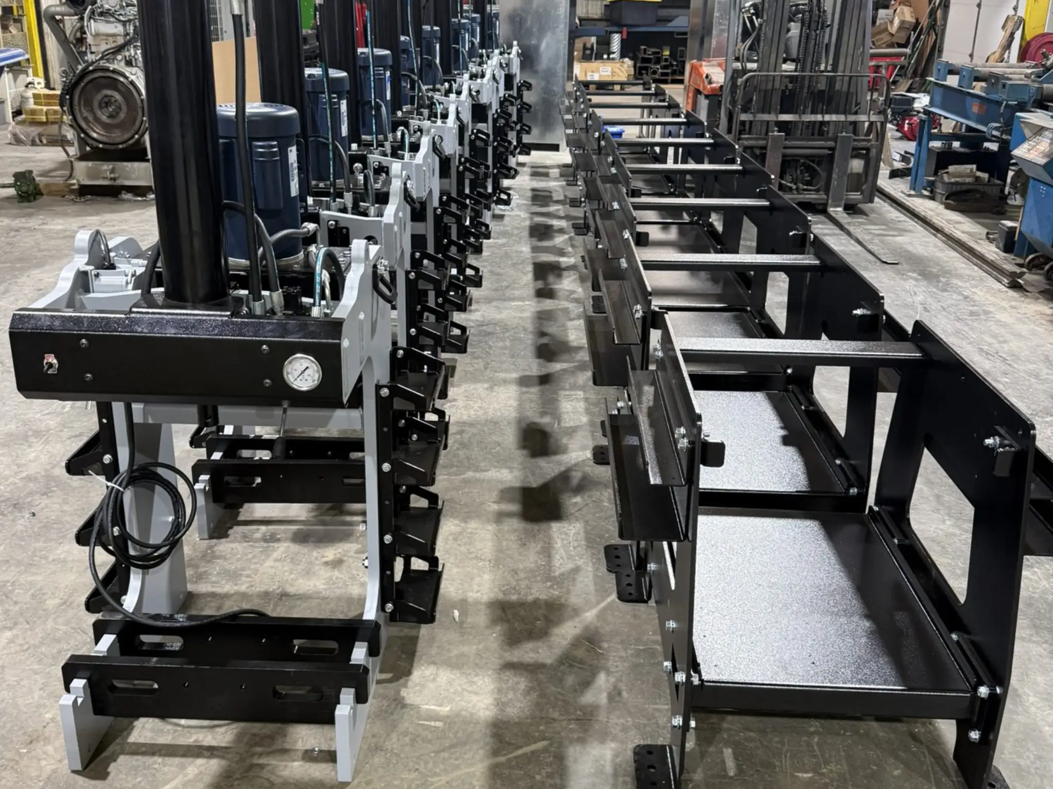 Industrial machinery lined up in a workshop.