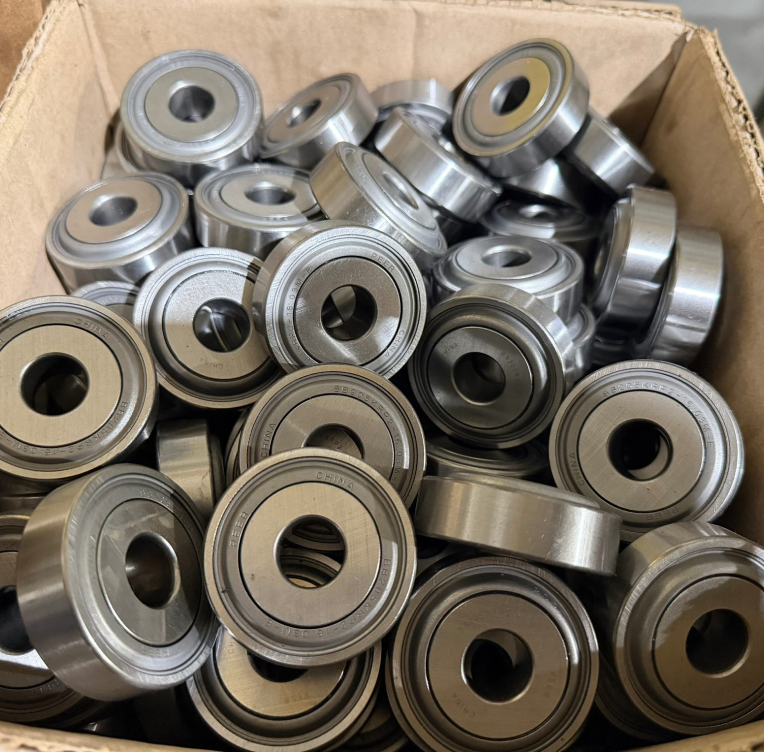 Box filled with metal ball bearings.