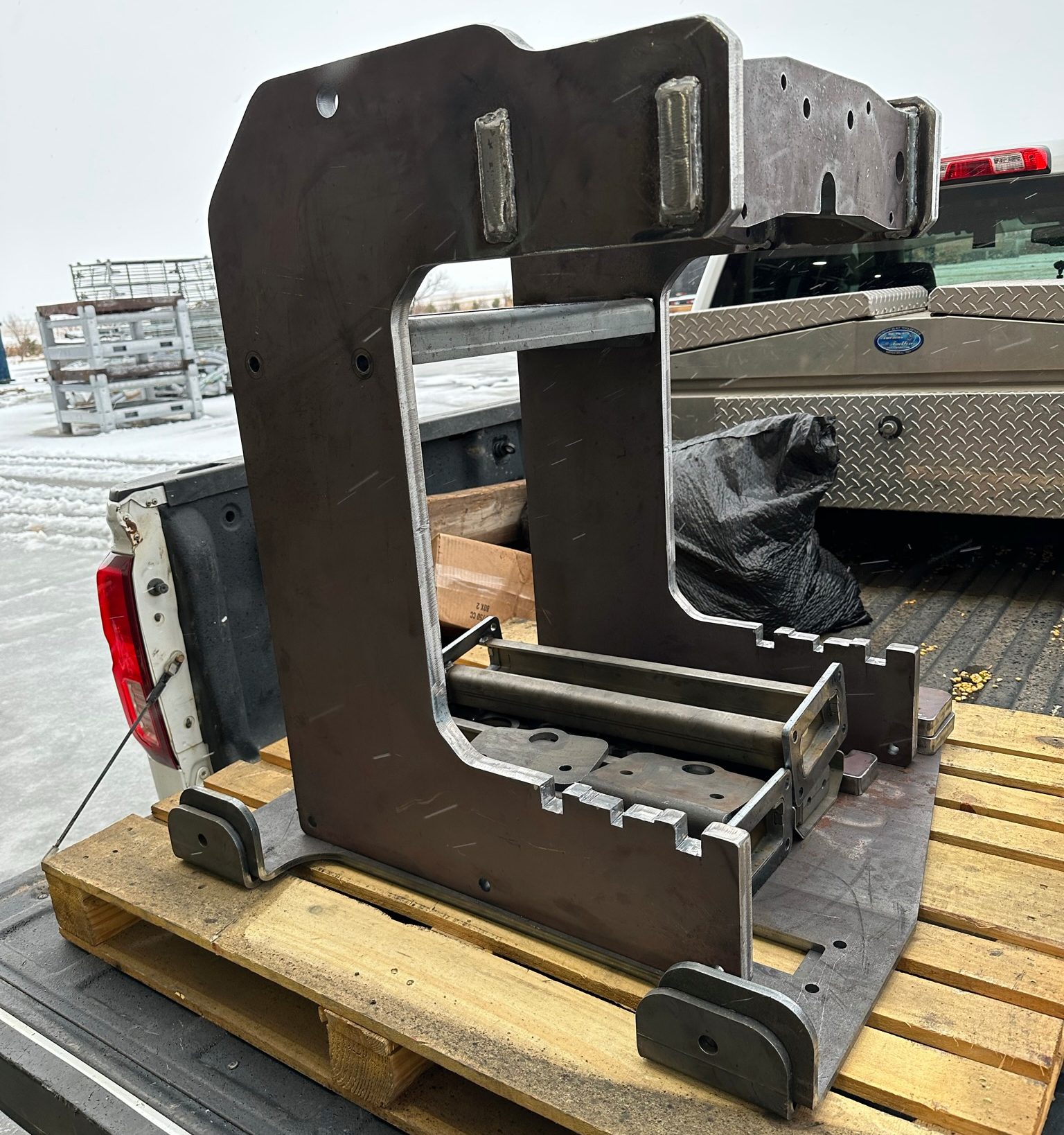 Industrial metal frame on wooden pallet.